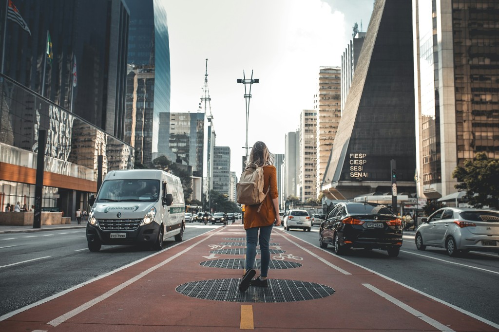 Woman walking on the red bike lane on Avenida Paulista, São Paulo
